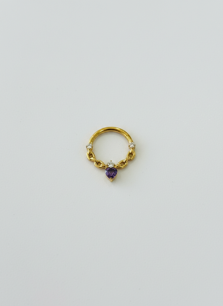 Piercing clicker titanio 16G, con zirconias transparente y morada en gota - piercings Mundo Chic